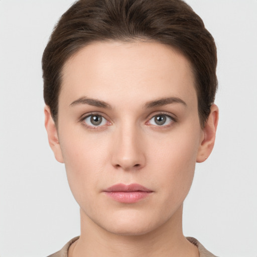 Neutral white young-adult female with short  brown hair and brown eyes