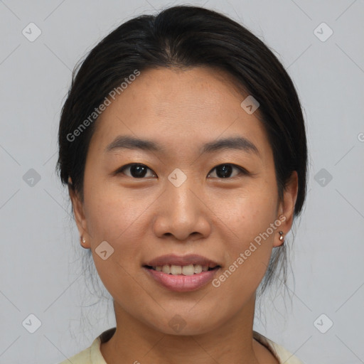 Joyful asian young-adult female with medium  brown hair and brown eyes