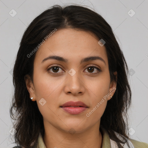 Joyful latino young-adult female with medium  brown hair and brown eyes