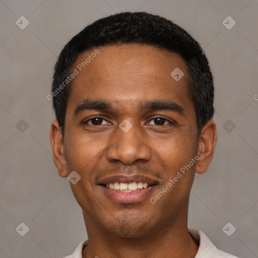 Joyful black young-adult male with short  black hair and brown eyes