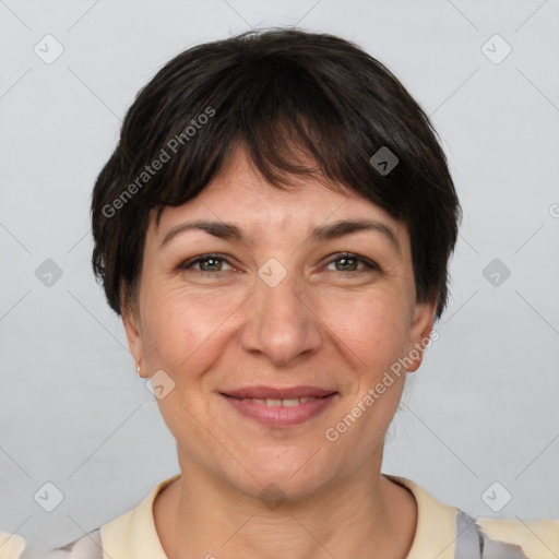 Joyful white adult female with short  brown hair and brown eyes