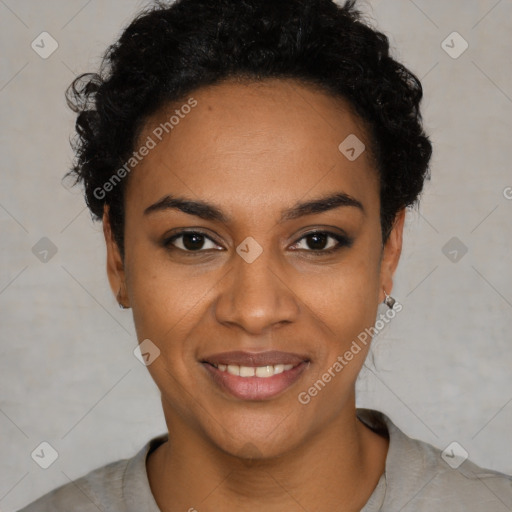 Joyful black young-adult female with short  black hair and brown eyes