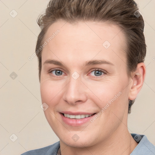 Joyful white young-adult female with short  brown hair and grey eyes