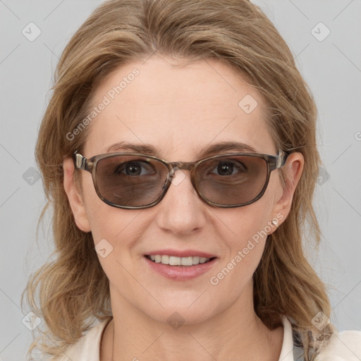 Joyful white young-adult female with medium  brown hair and blue eyes