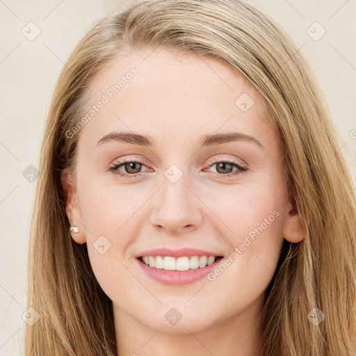 Joyful white young-adult female with long  brown hair and blue eyes