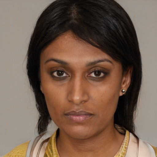Neutral asian young-adult female with medium  brown hair and brown eyes