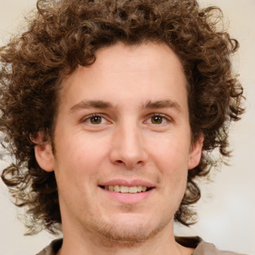 Joyful white young-adult male with medium  brown hair and brown eyes