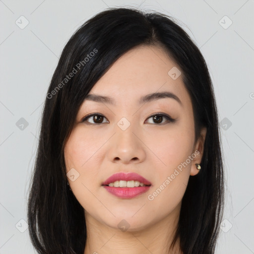 Joyful asian young-adult female with long  black hair and brown eyes