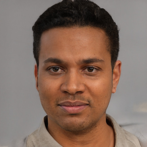 Neutral latino young-adult male with short  black hair and brown eyes
