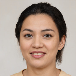 Joyful latino young-adult female with medium  brown hair and brown eyes