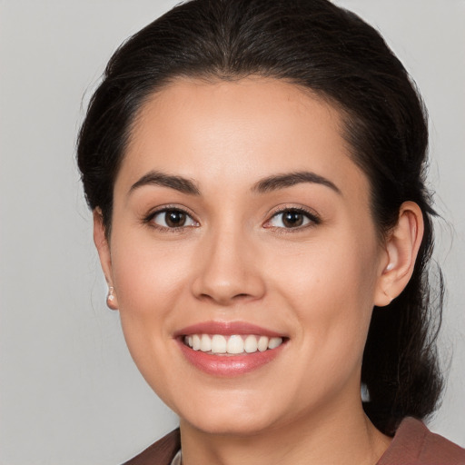 Joyful white young-adult female with medium  brown hair and brown eyes