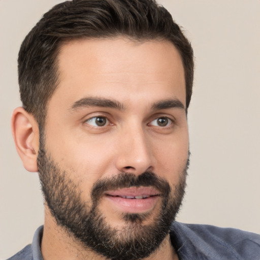 Joyful white young-adult male with short  brown hair and brown eyes