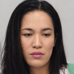 Joyful asian young-adult female with long  brown hair and brown eyes