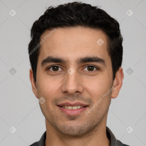 Joyful white young-adult male with short  black hair and brown eyes