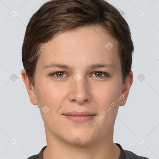 Joyful white young-adult female with short  brown hair and grey eyes