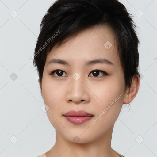 Joyful asian young-adult female with short  black hair and brown eyes