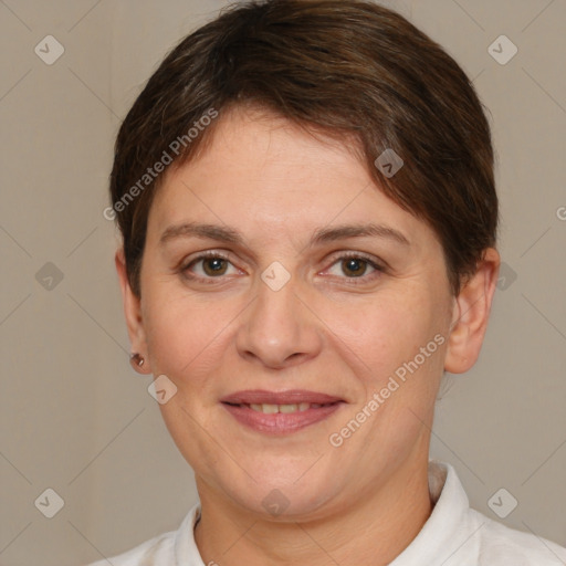 Joyful white adult female with short  brown hair and brown eyes