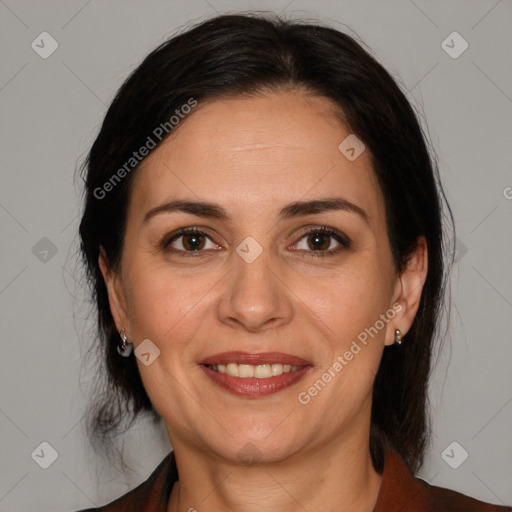 Joyful white adult female with medium  brown hair and brown eyes