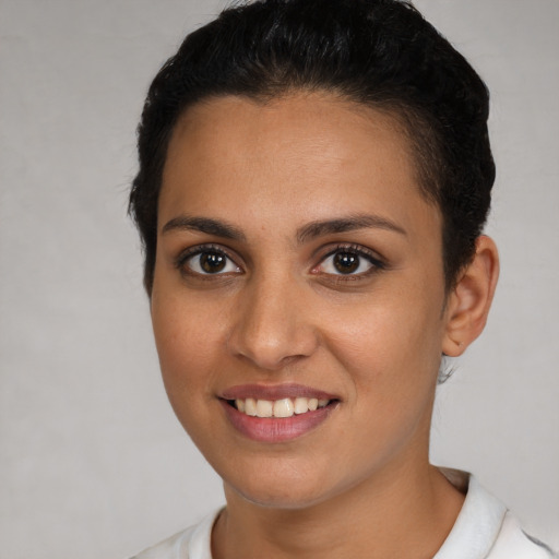 Joyful white young-adult female with short  brown hair and brown eyes