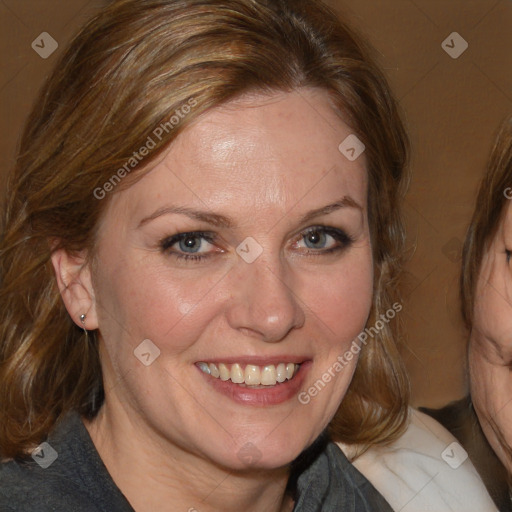 Joyful white adult female with medium  brown hair and blue eyes