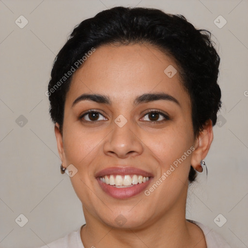 Joyful latino young-adult female with short  black hair and brown eyes