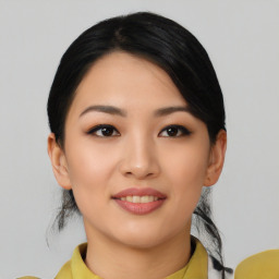 Joyful asian young-adult female with medium  black hair and brown eyes