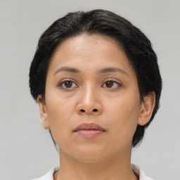 Neutral asian young-adult female with short  brown hair and brown eyes