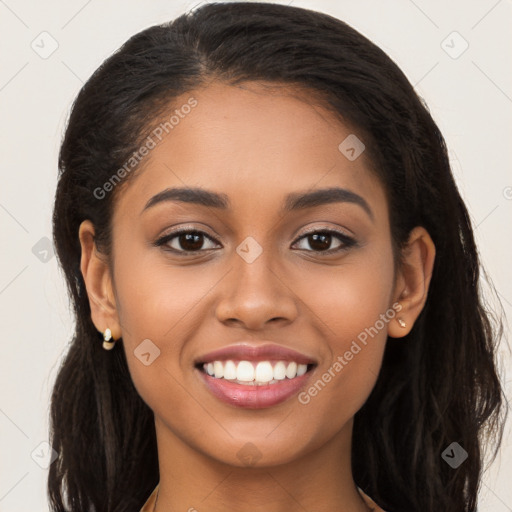 Joyful latino young-adult female with long  brown hair and brown eyes