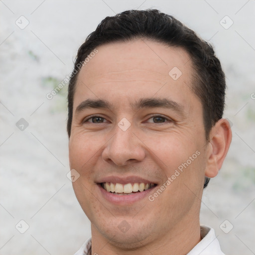 Joyful white young-adult male with short  brown hair and brown eyes