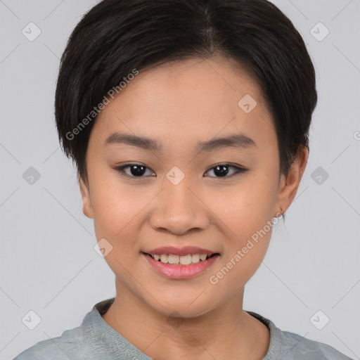 Joyful asian young-adult female with short  black hair and brown eyes