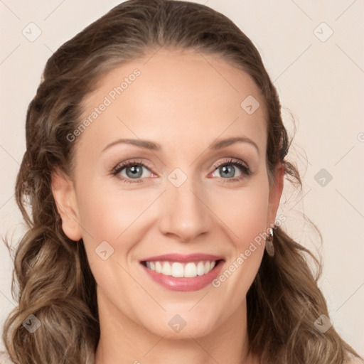 Joyful white young-adult female with long  brown hair and blue eyes