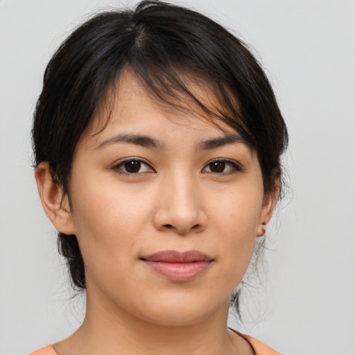 Joyful asian young-adult female with medium  brown hair and brown eyes