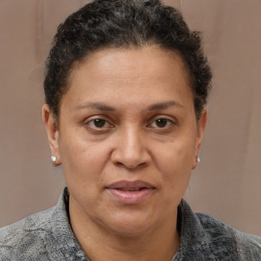 Joyful white adult female with short  brown hair and brown eyes