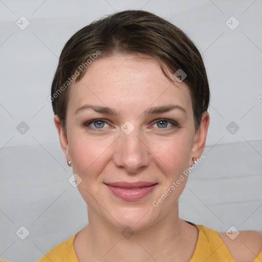 Joyful white young-adult female with short  brown hair and grey eyes