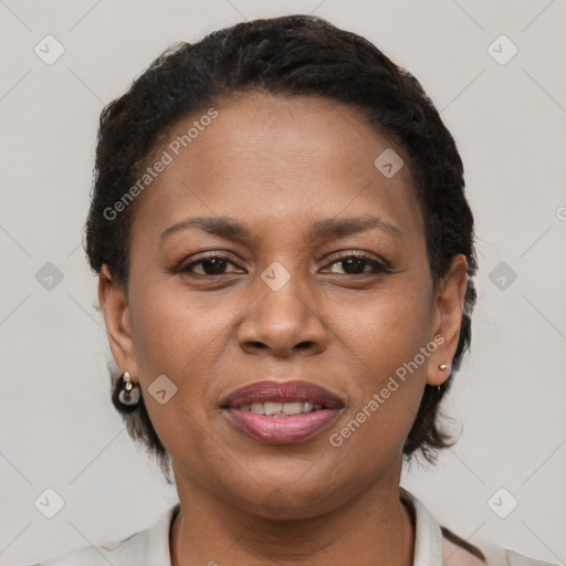 Joyful black young-adult female with short  brown hair and brown eyes