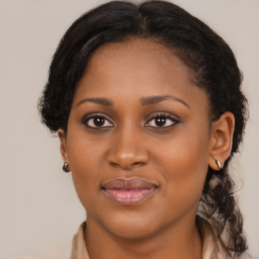 Joyful black young-adult female with medium  brown hair and brown eyes