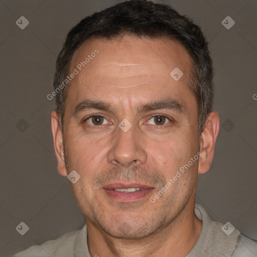 Joyful white adult male with short  brown hair and brown eyes