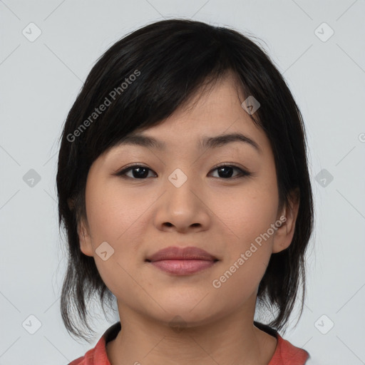 Joyful asian young-adult female with medium  black hair and brown eyes