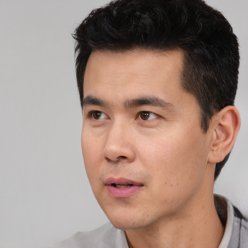 Neutral asian young-adult male with short  black hair and brown eyes