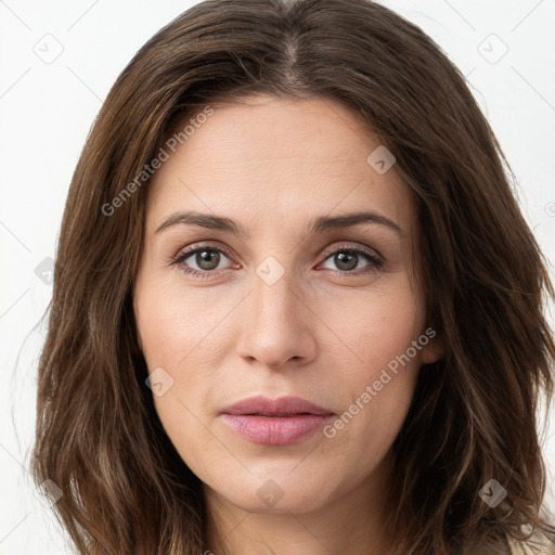 Joyful white young-adult female with long  brown hair and green eyes