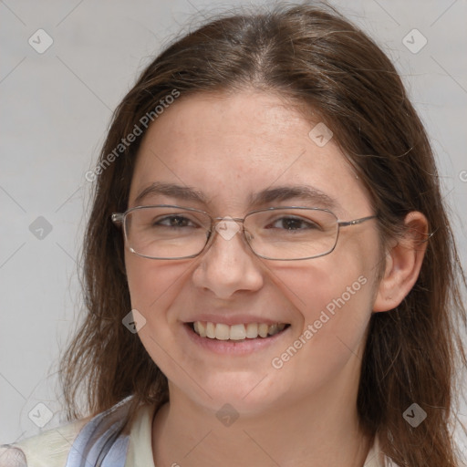 Joyful white adult female with long  brown hair and grey eyes