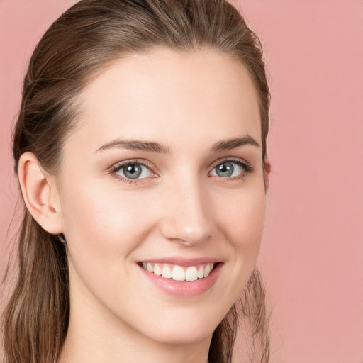 Joyful white young-adult female with long  brown hair and grey eyes