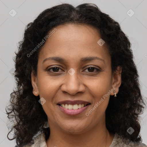 Joyful black adult female with medium  brown hair and brown eyes