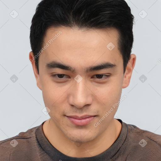 Joyful asian young-adult male with short  brown hair and brown eyes