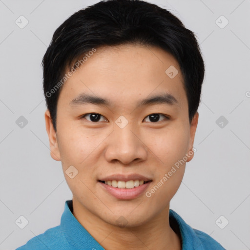 Joyful asian young-adult male with short  black hair and brown eyes