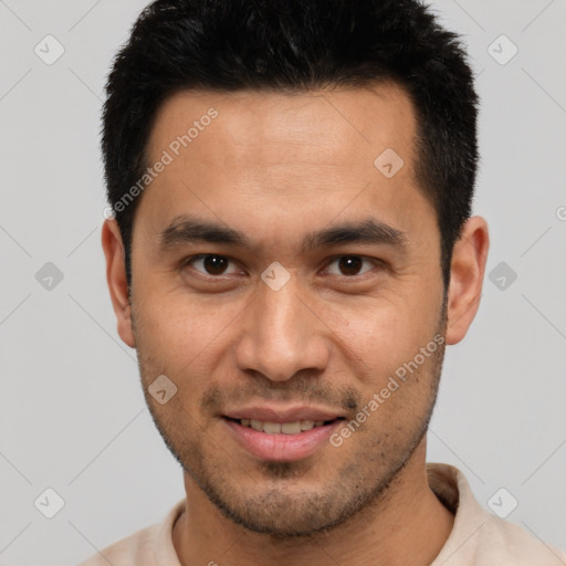 Joyful white young-adult male with short  black hair and brown eyes