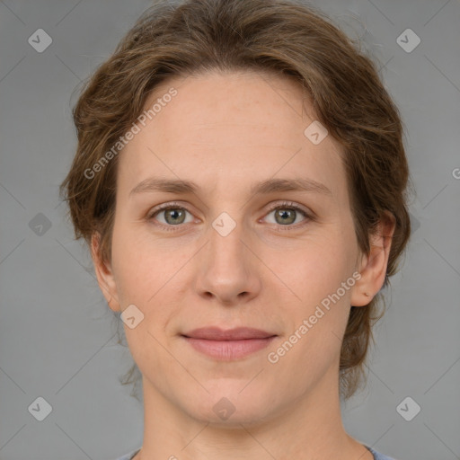 Joyful white young-adult female with medium  brown hair and green eyes