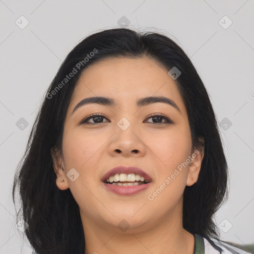 Joyful asian young-adult female with long  brown hair and brown eyes