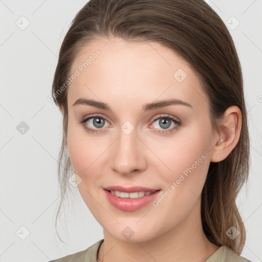 Joyful white young-adult female with long  brown hair and grey eyes