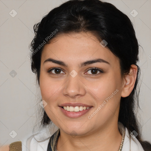 Joyful latino young-adult female with medium  brown hair and brown eyes